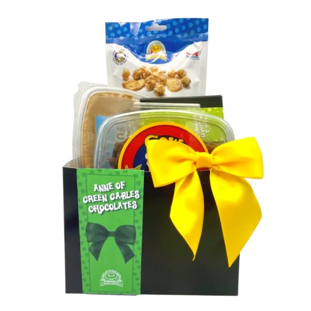 Basket with Anne of Green Gables themed products including COW chips, Anne caramel corn, fuge and 6-box of chocolates