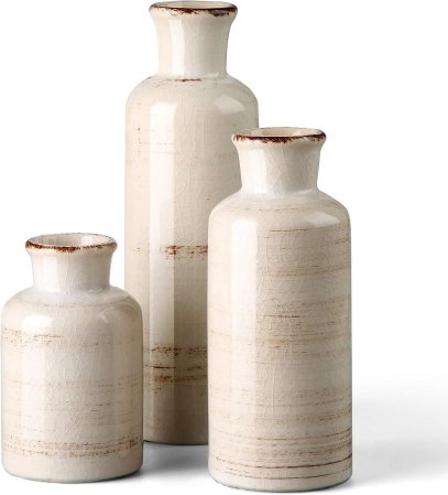 set of three ceramic vases in neutral tones